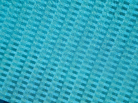 Aerial top down view of an empty resort swimming pool with sunbeds