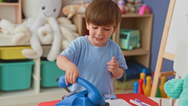 Boy holding a toy burger with both hands while reaching toward a pretend kitchen shelf and stuffed octopus in a colorful playroom inside a building; playful childhood moment.