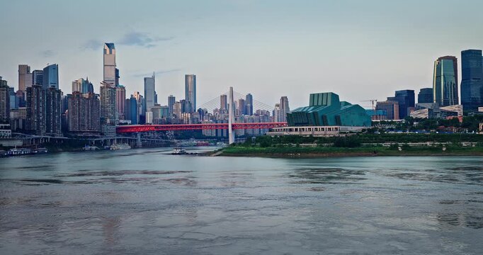 Modern city skyline with a river and a bridge in Chongqing, China