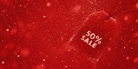 Red price tag with sale text against a speckled red background winter promotion discount offer