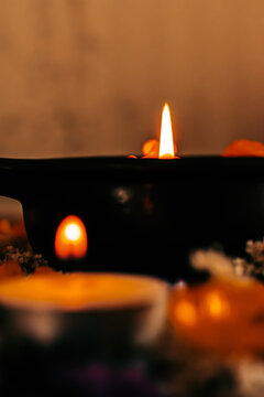 Warm Candlelight Glow with Floating Flowers and Soft Bokeh