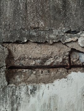 old brick wall
Close up of damaged concrete wall with cracks, exposed rusty rebar, and rough texture. Old weathered cement surface with peeling paint and deterioration. Perfect for construction, archi