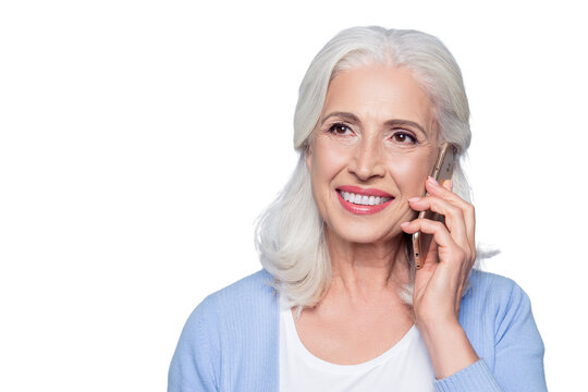 Close up portrait of happy joyful confident relaxed cheerful mature woman talking on smartphone, isolated on gray background, copyspace
