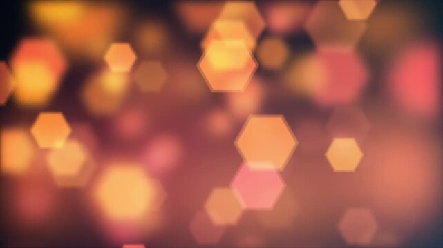 Glowing hexagonal bokeh lights floating in a dark abstract background