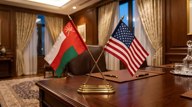Oman and United States Small Desk Flags on a Luxury Wooden Office Table for Diplomatic Meetings