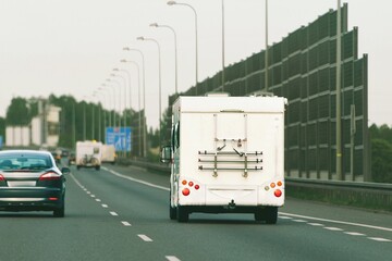Naklejka premium RV camper van traveling toward peaceful holiday destination
