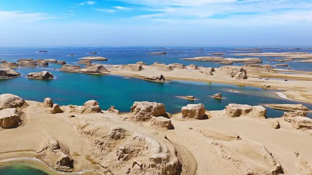 Aerial view of water yardang landforms and sand dunes in Qinghai, China