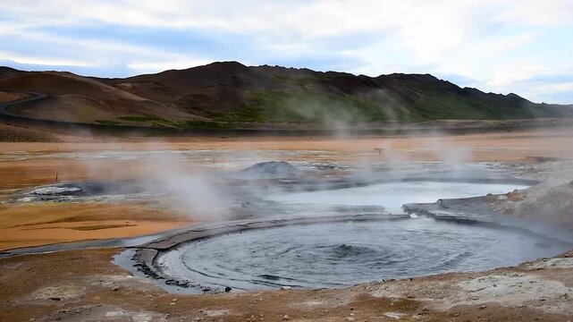 A breathtaking spectacle with the gurgling of a bubbling geyser  in Hverir (Hverarond) valley  in the Myvatn region. Iceland.