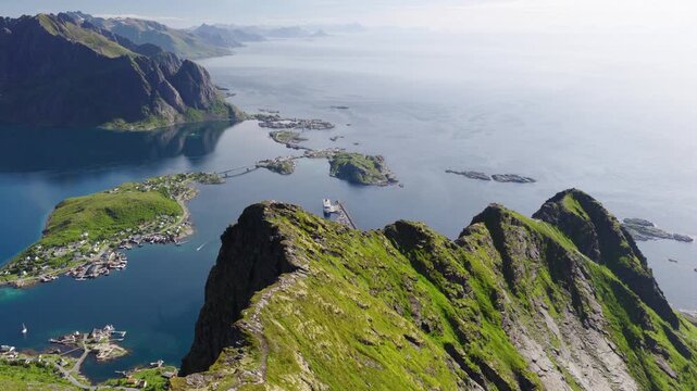 Spectacular 4K Drone Aerial of Reinebringen Overlooking Reine Village and Fjords, Lofoten Islands, Norway
