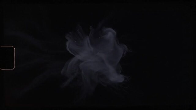 White ethereal smoke burst with vintage film sprocket hole effect on black background