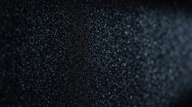 White mist spray and floating particles moving through dark space for creative video overlays