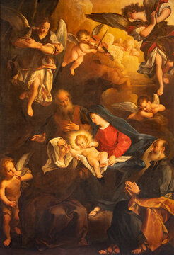 LUCCA, ITALY - JUNE 23, 2026:  The painting of Holy Family among the angels in the church Chiesa di Sata Anna by Giovan Domenico Lombardi (1724 - 1725).