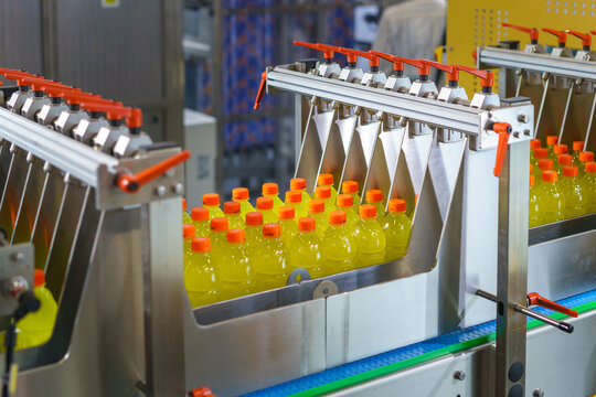 Automated Machine Sorting Yellow Beverage Bottles