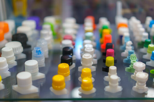 Assorted Colorful Plastic Spout Caps on Display