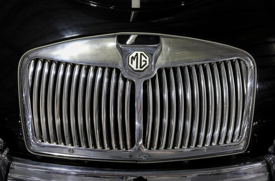 Perth, Western Australia, Australia - May 3 2026: Classic 1958 MG MGA twin cam roadster front chrome radiator grille. Iconic octagonal mg emblem badge. Vintage British luxury sports performance car
