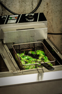 Padron Peppers Deep Frying in Commercial Kitchen Fryer &ndash; Spanish Tapas