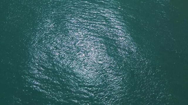 Aerial Top Down View of Sparkling Turquoise Sea Water Surface