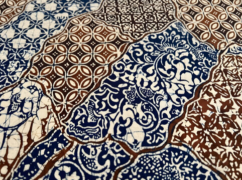 Close-up of traditional Javanese batik Sekar Jagad patchwork motif combining multiple flower and geometric patterns, Indonesian unity concept
