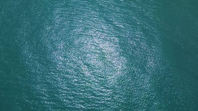 Aerial Top Down View of Sparkling Turquoise Sea Water Surface