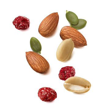 Peanut and almond nuts, pumpkin seeds, cranberry isolated on white background. Real photography