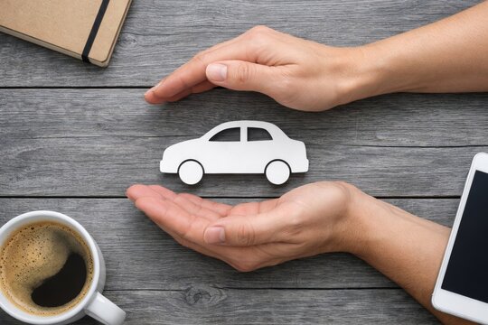 Hands Protecting Car Insurance Symbol on Wooden Background. Ai generative