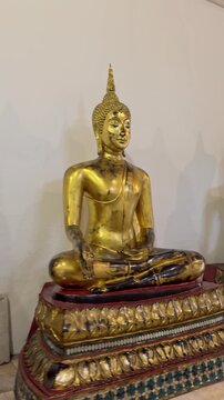 Golden Buddha statues sitting in a Bangkok temple