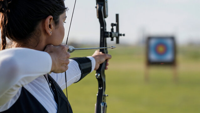 Close Up of an Archer Aiming at the Target with Intense Focus