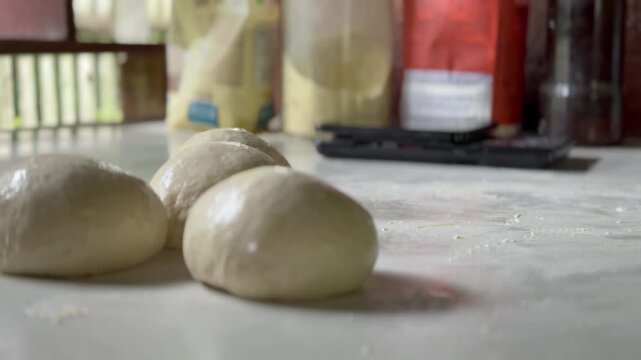 Preparation homemade pizza on kitchen table