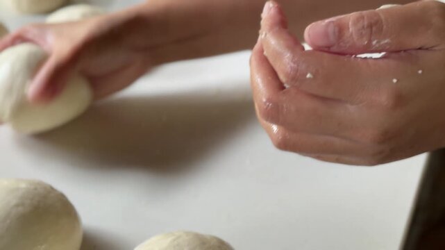 Preparation homemade pizza on kitchen table