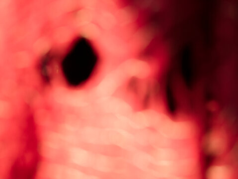 red blurred background that looks like an abstract object