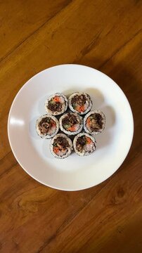 4K Top View Video of Korean Bulgogi Kimbap Rice Rolls with Beef and Vegetables for Korean Cuisine and Food Documentary Footage