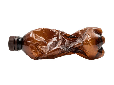 A single empty brown plastic bottle crushed and deformed for recycling waste management and environmental pollution concepts isolated on transparent background