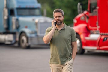 Mobile communication. Mature man driver of truck talk on phone. Professional trucker. Truck driver has phone call. Man trucker driver at lorry truck. Semi trucks vehicle. Hispanic man trucker