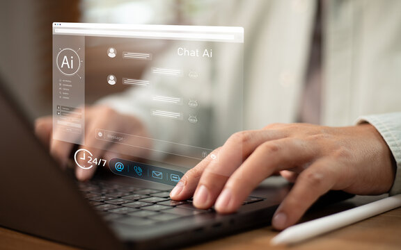 Businessperson typing on laptop with virtual Chat AI assistant web interface window for automated customer service, online support chat bot, smart virtual helpdesk 24 7 assistance technology concept