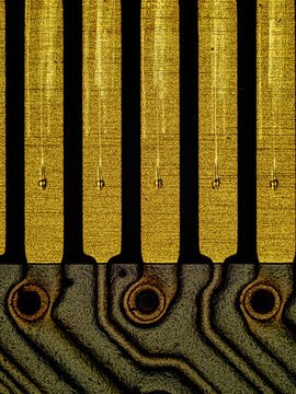 Macro view of gold contacts on laptop RAM memory module