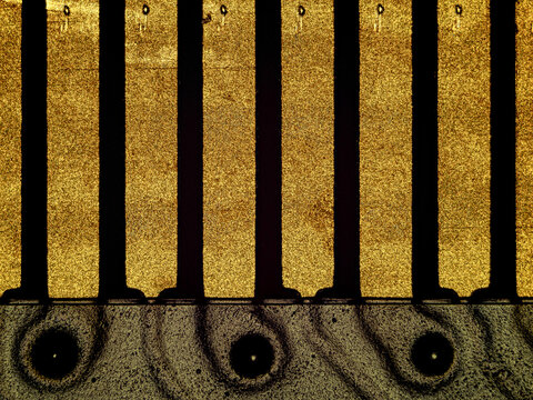 Macro close-up of gold connector contacts on computer memory module