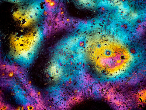 Abstract colorful microscopic texture with iridescent interference patterns