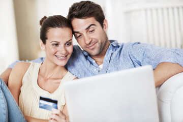 Fototapeta premium Credit card, laptop and reading with couple on sofa in home for travel planning, payment and flight booking. Airline ticket, holiday budget and honeymoon research with man and woman in living room