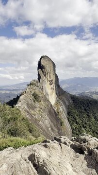Pedra do Ba&uacute; in S&atilde;o Bento do Sapuca&iacute; in vertical video. Rock climbing site. Atlantic Forrest.