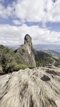 Pedra do Ba&uacute; in S&atilde;o Bento do Sapuca&iacute; in vertical video. Rock climbing site. Atlantic Forrest.