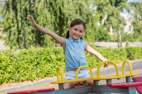 Joyful childhood moments filled with laughter at the park on a sunny day
