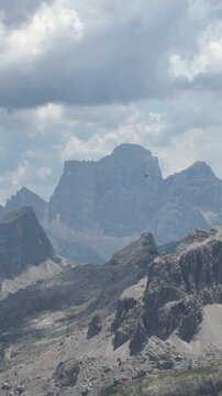 Mountain landscape with alpine choughs flying
