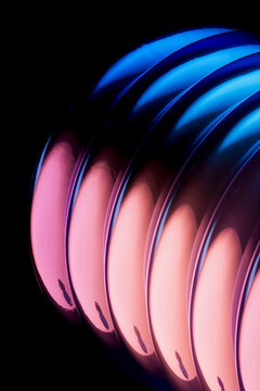 3D neon ribbed sphere with blue shell and pink glow