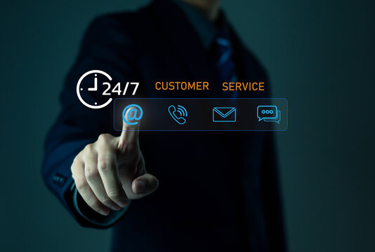 business professional typing on a laptop with a 24 service icon overlay, symbolizing continuous support, online availability, customer service accessibility, and nonstop digital operation in a modern.