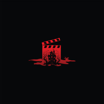 Horror movie clapperboard with a haunted house and blood splatter.