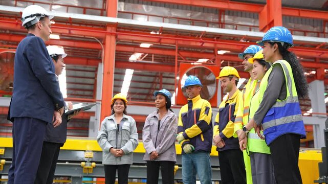 Diverse team members engage in a collaborative meeting focused on enhancing safety protocols in an industrial setting