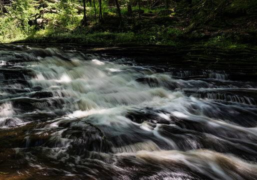 Photograph of cascading water in the forest 