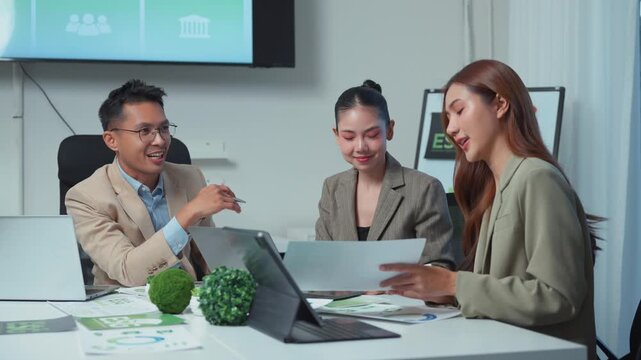 Business team discussing corporate social responsibility and ESG strategy in a modern office meeting