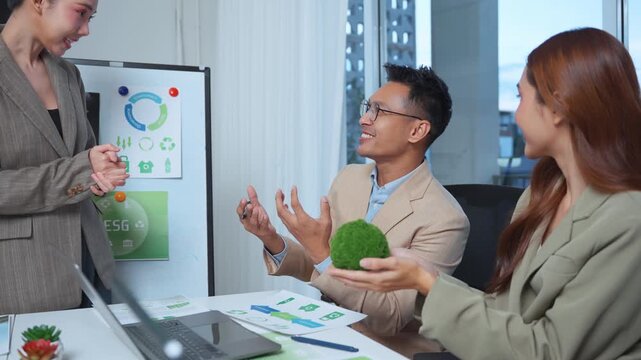 Business team discussing corporate ESG policy and environmental conservation in a modern office meeting