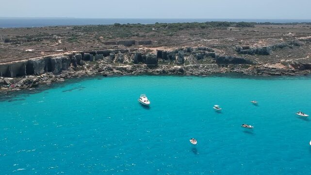 Turquoise Ocean and Rocky Coast of Favignana Sicily Italy Aerial Drone View With Boats Clear Water and Summer Seascape
